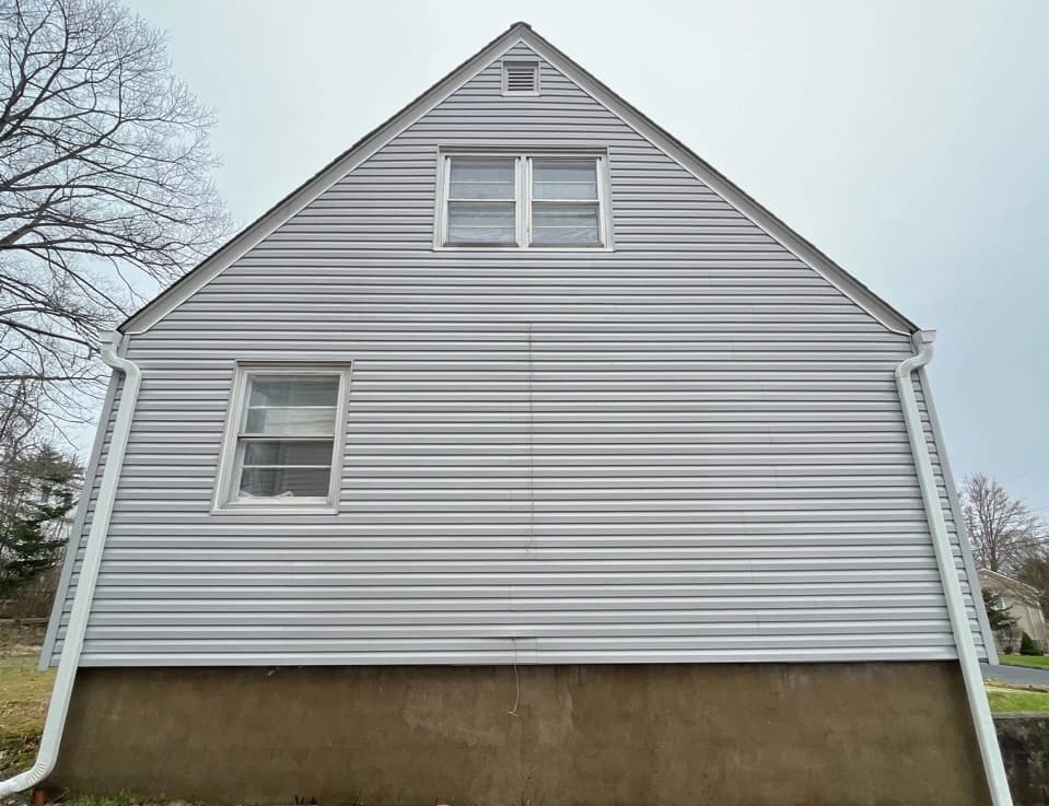 Brecksville Power Washing technician performing detailed house washing in Brecksville residential area